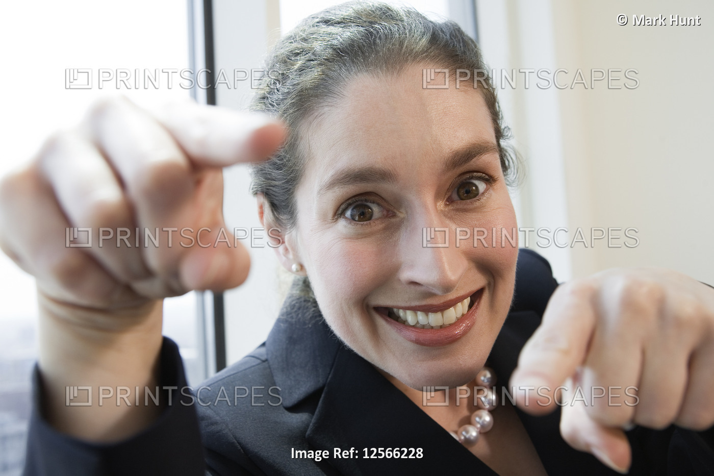Portrait of businesswoman smiling in an office.