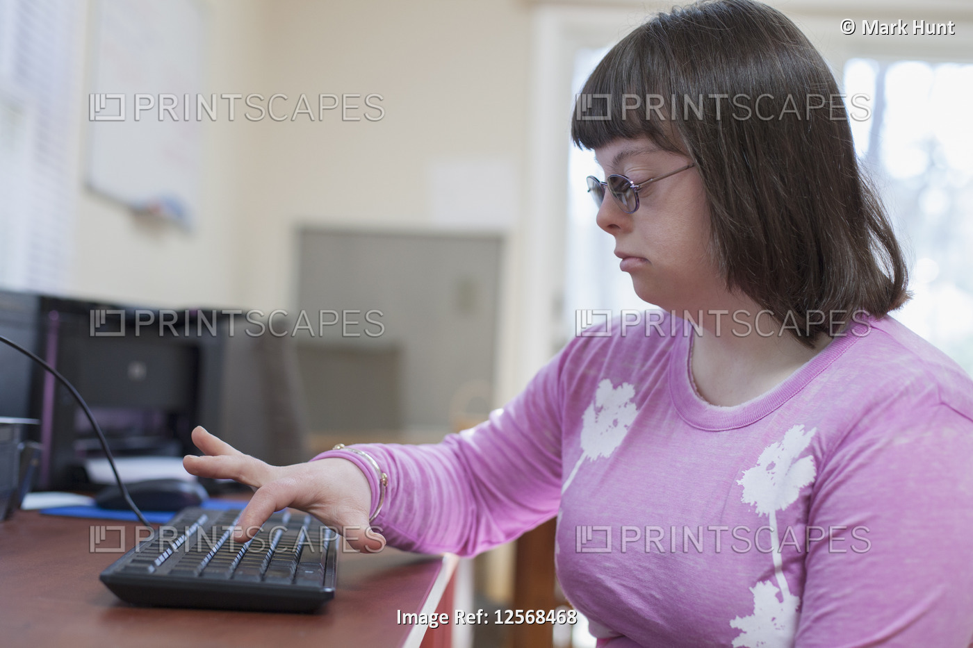 Woman with Down Syndrome using her computer