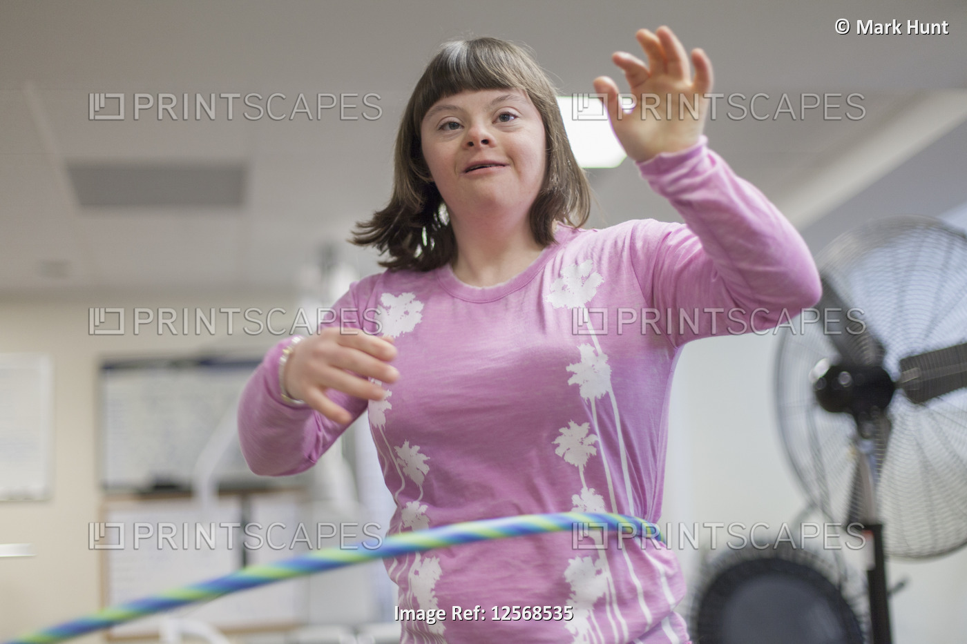 Girl with Down Syndrome using a hula hoop