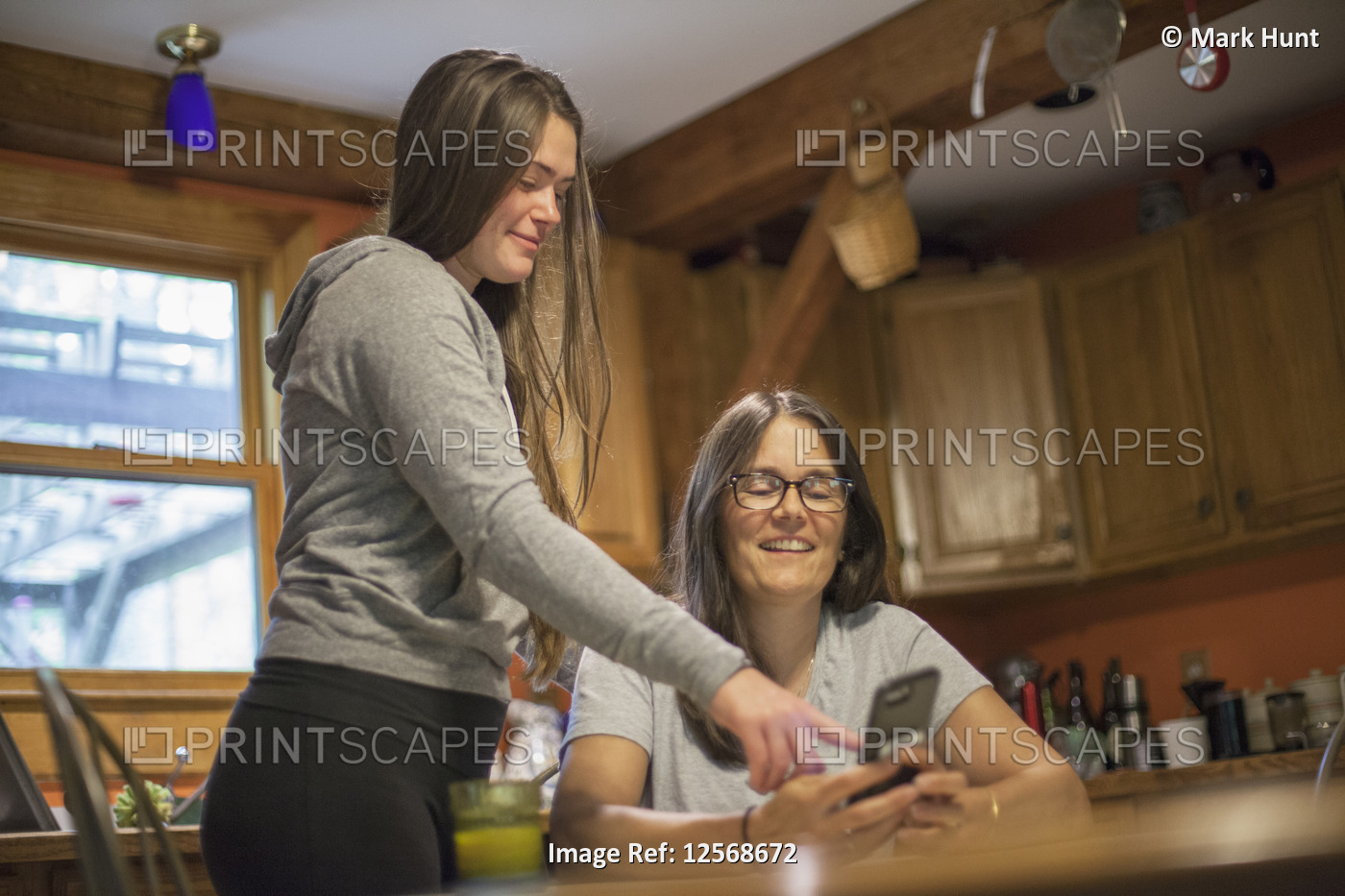 Woman with Multiple Sclerosis talking to her daughter about a text message on ...