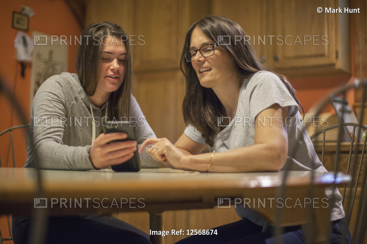 Woman with Multiple Sclerosis talking to her daughter about a text message on ...