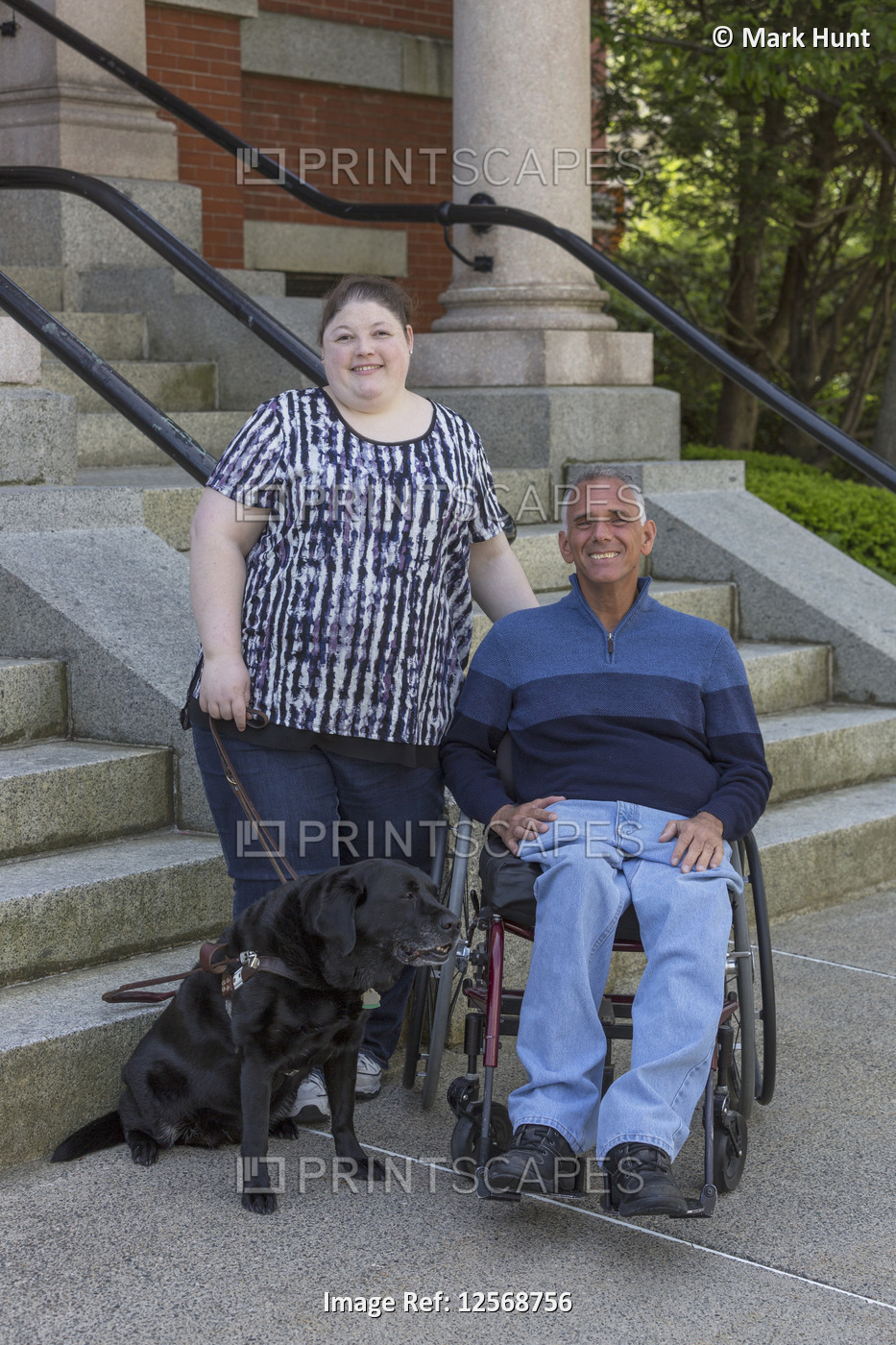 Man with Spinal Cord Injury sitting with his daughter who is Blind