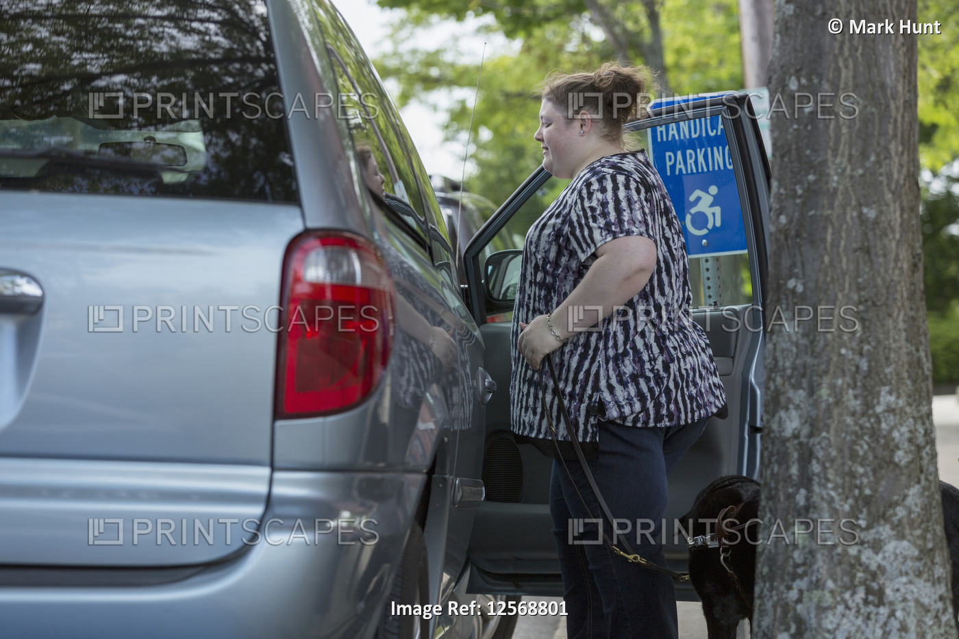 Woman with Visual Impairment entering a car