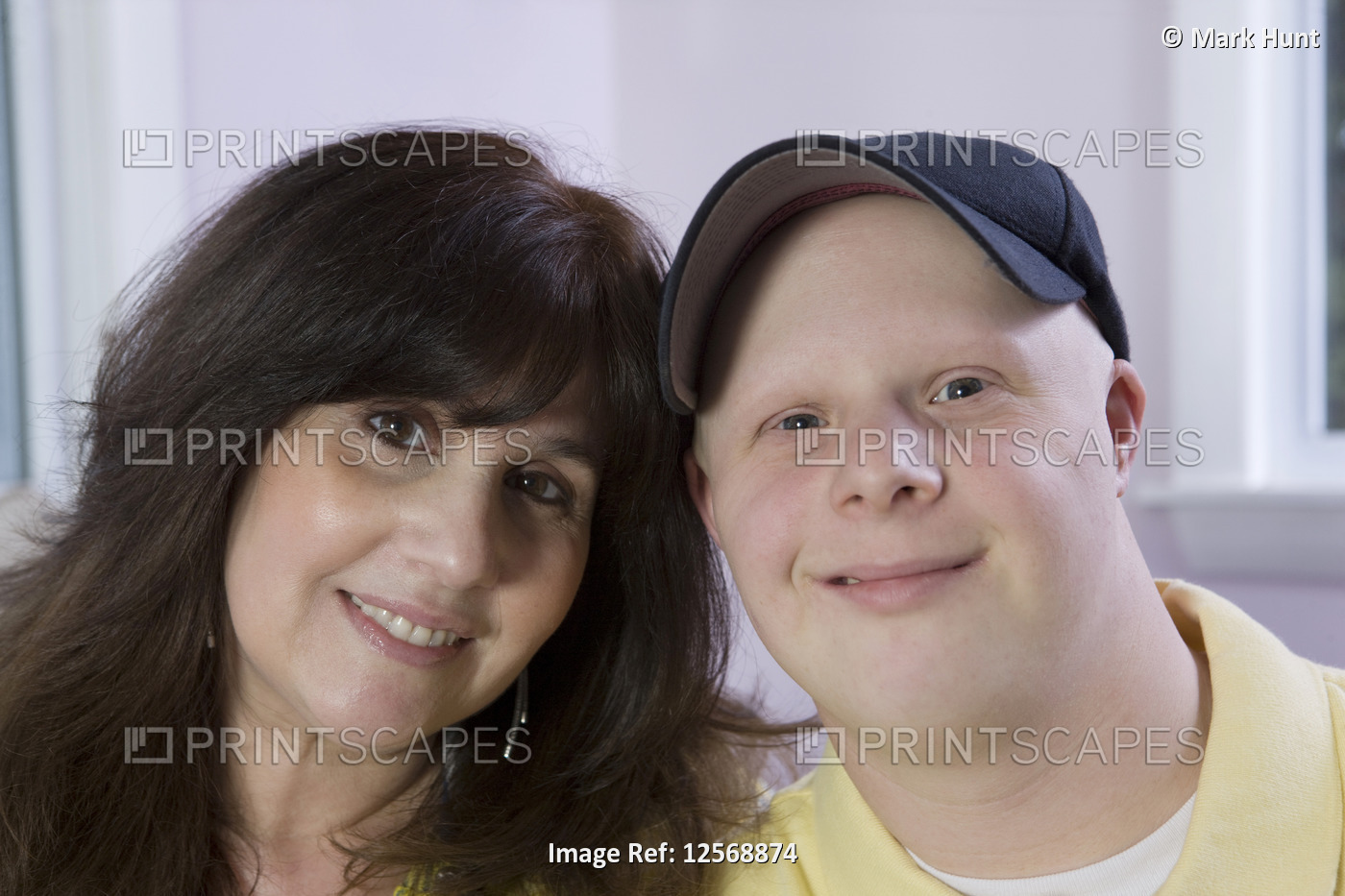 Portrait of a woman with her son with Down Syndrome