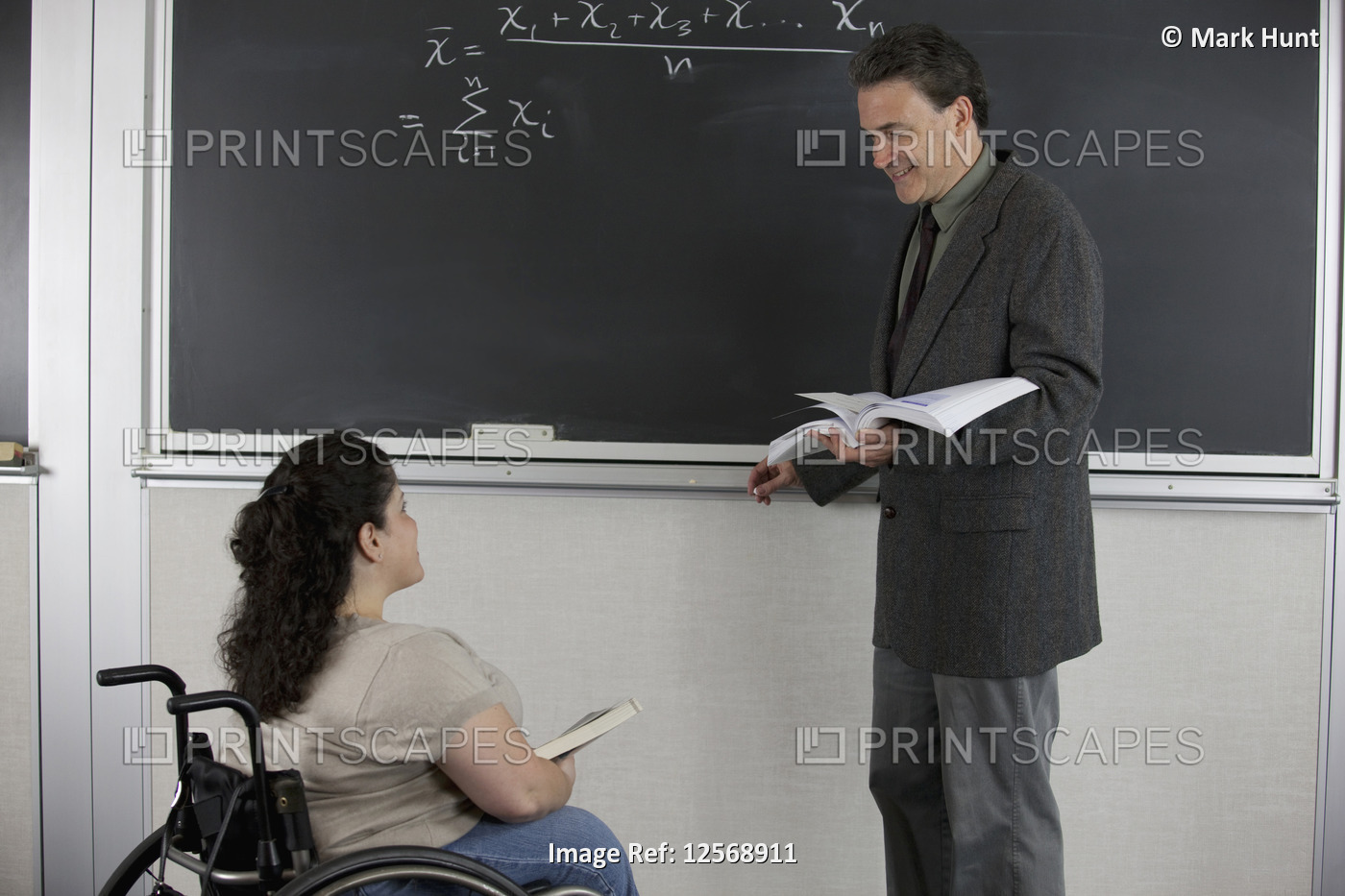 Professor and student with Spina Bifida in a classroom