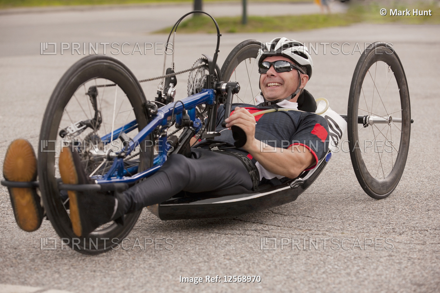 Man with spinal cord injury participating in a handcycle race