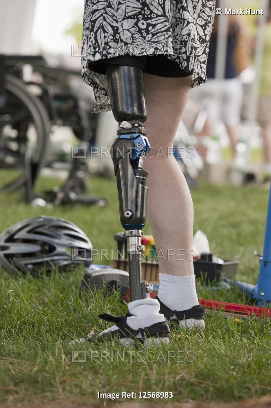 Woman with prosthetic leg preparing for bike race