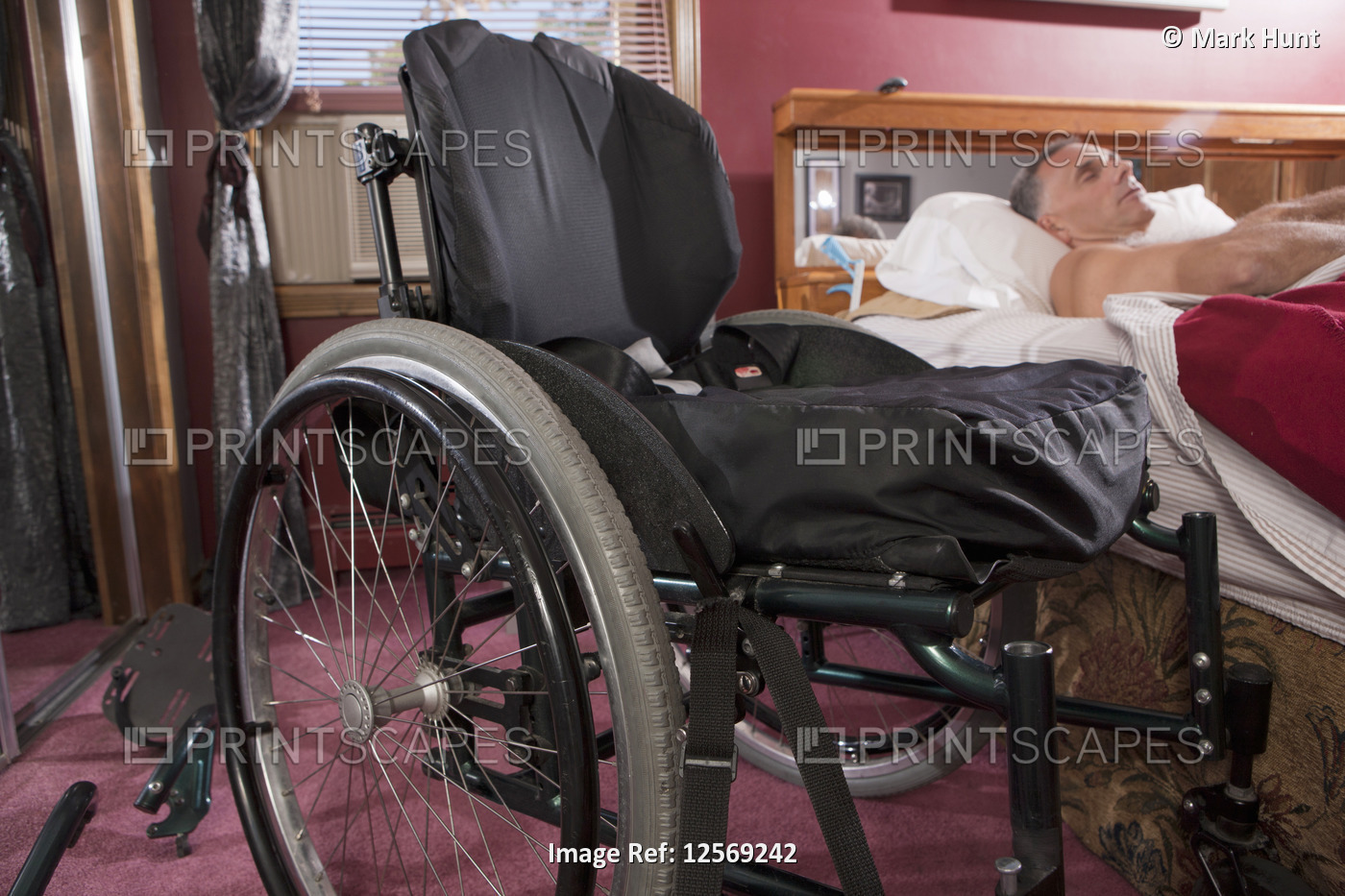 Man with spinal cord injury sleeping on the bed