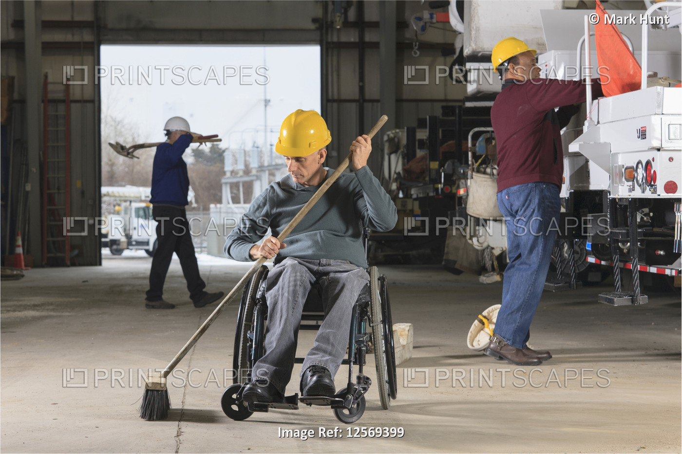Maintenance technicians, one with a spinal cord injury, cleaning in utility ...