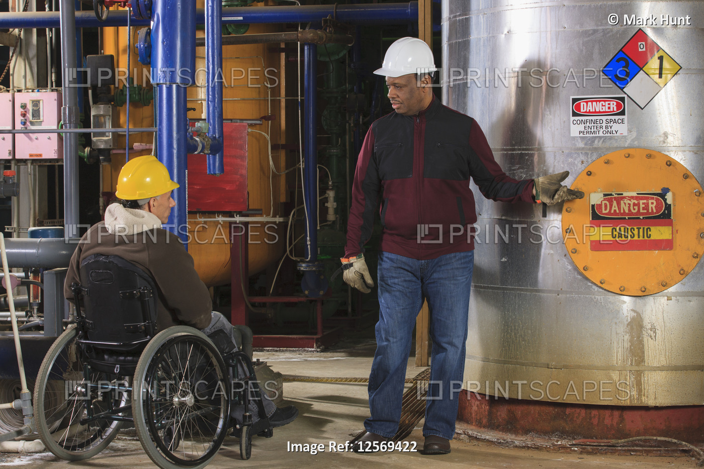 Power Plant engineers one with spinal cord injury discussing demineralization ...