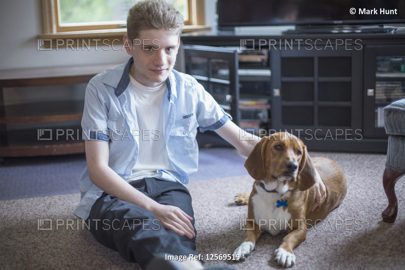 Man with Anxiety Disorder sitting with his therapy dog