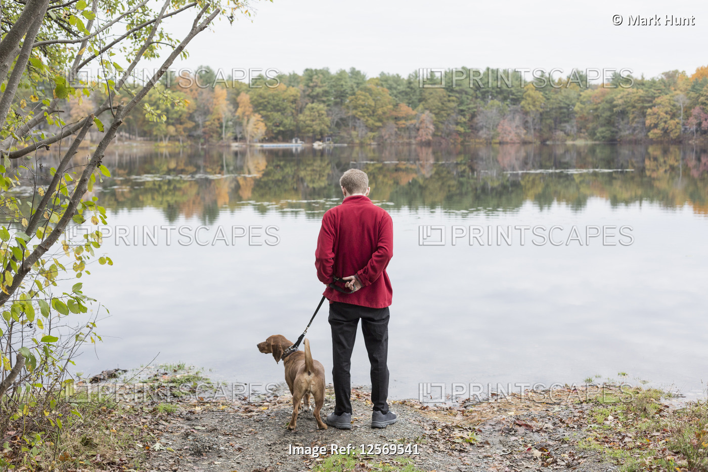 Man with Anxiety Disorder and his therapy dog at a lake