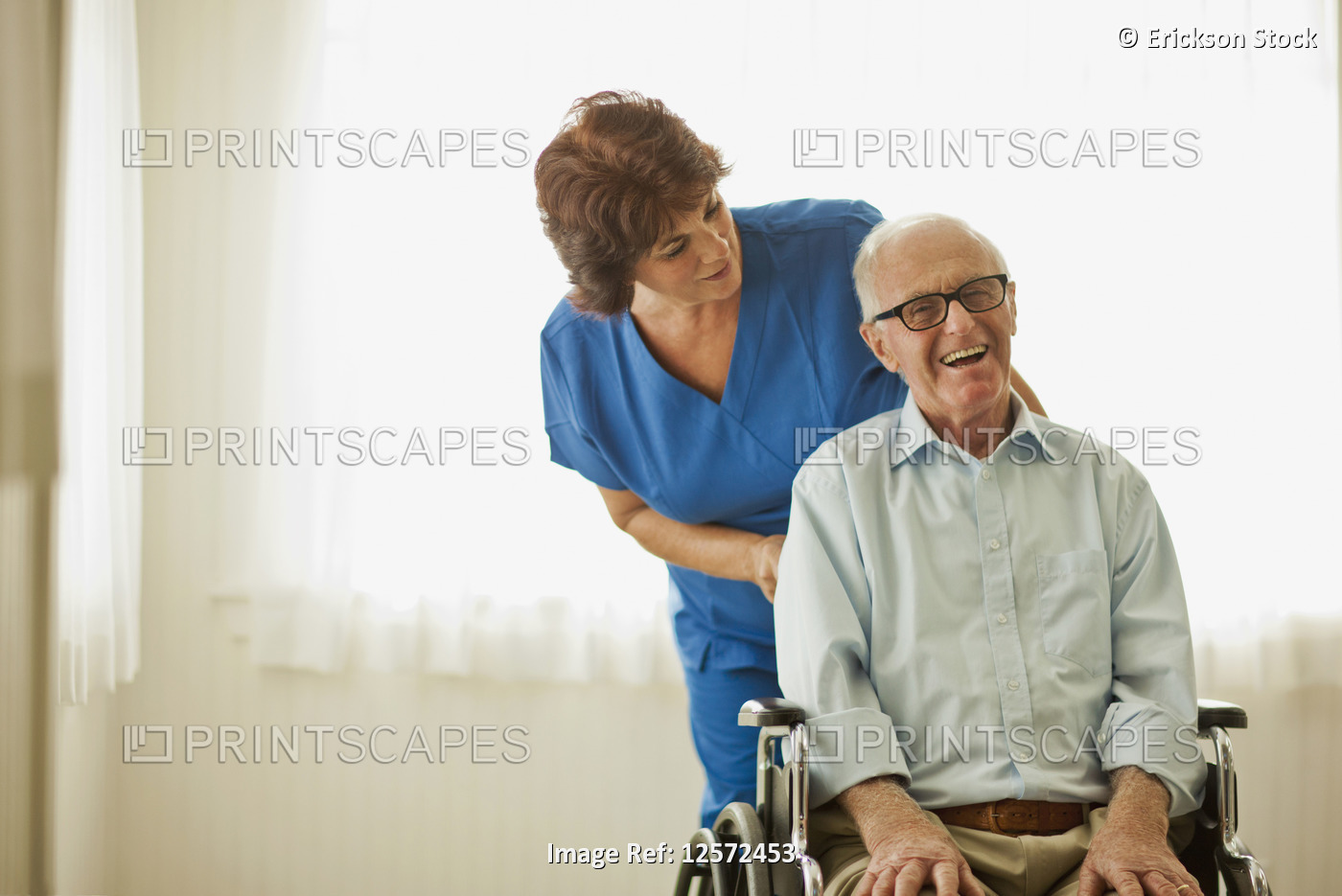 Portrait of a smiling senior man being comforted by a nurse while sitting in a ...