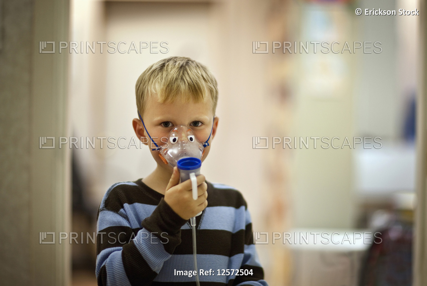 Portrait of young boy with oxygen mask.