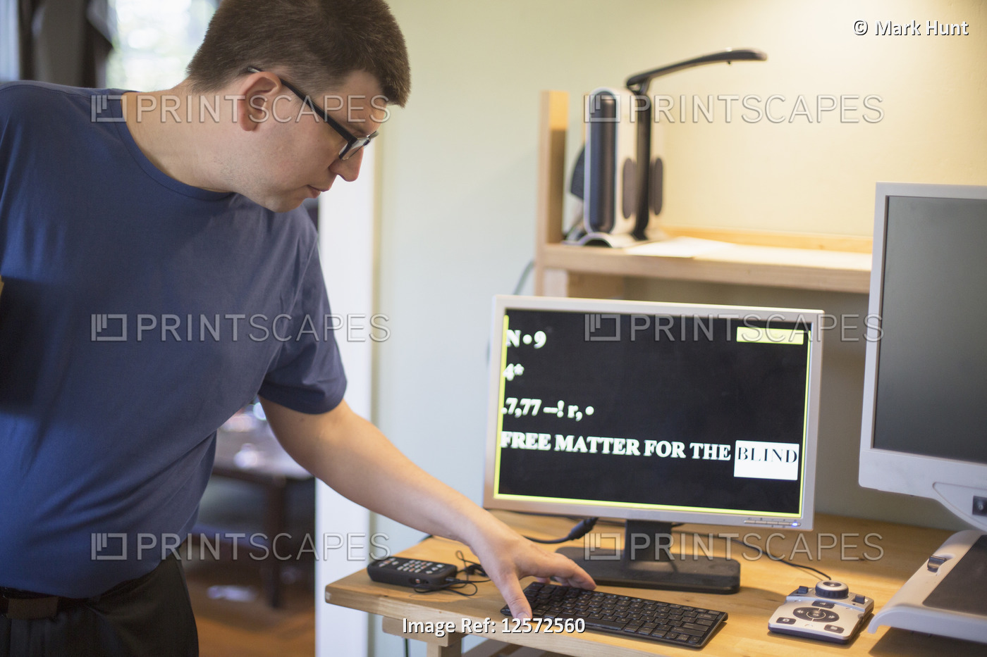 Man with Visual Impairment using his computer
