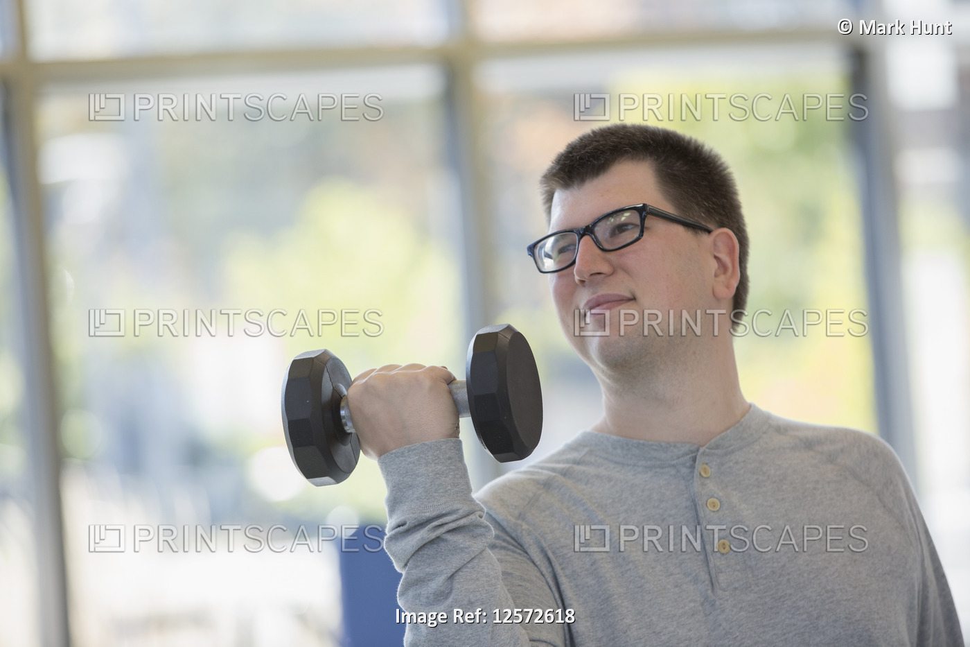 Man with Visual Impairment working out with dumbbell