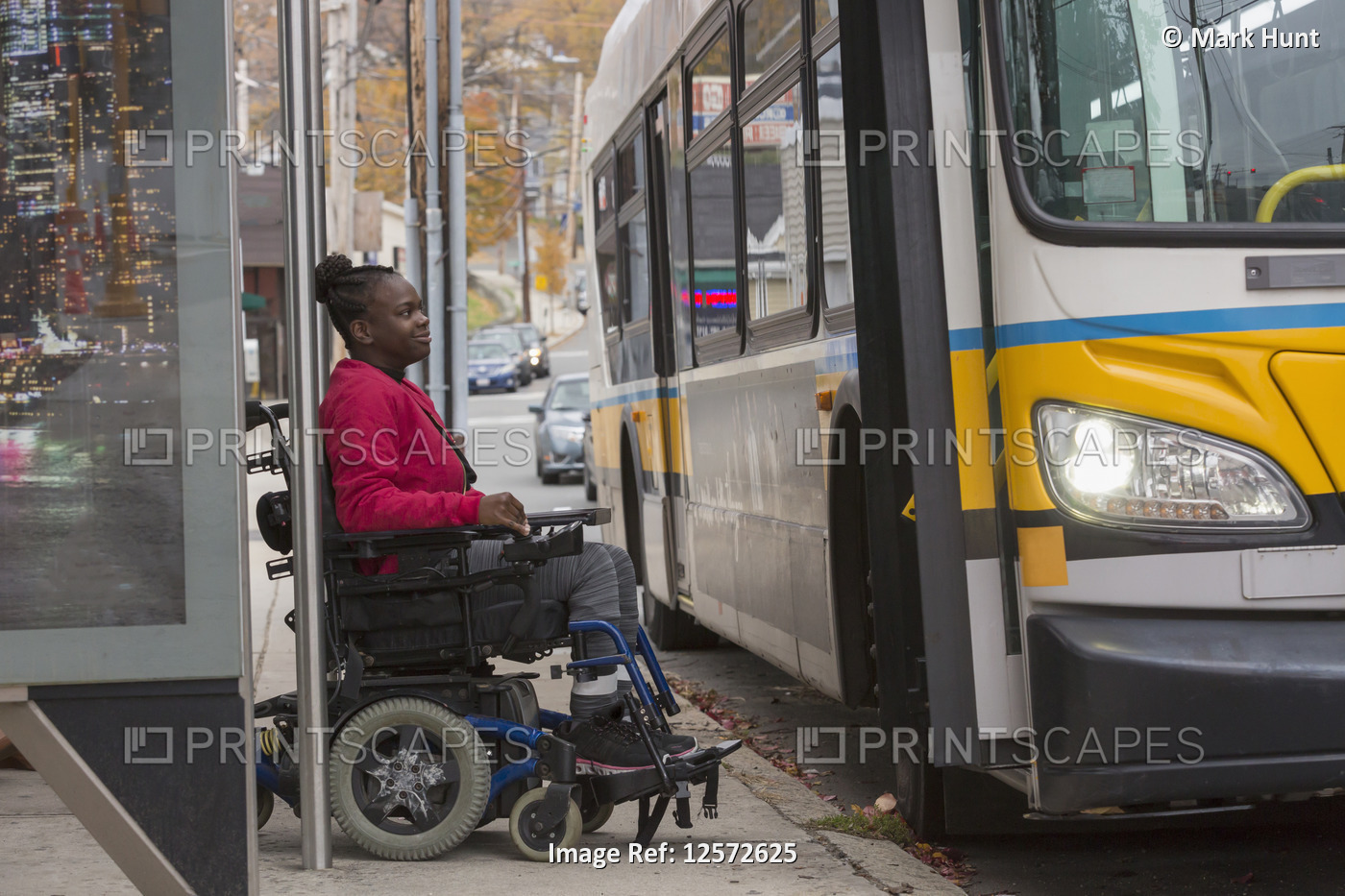 Teen with Cerebral Palsy at bus stop