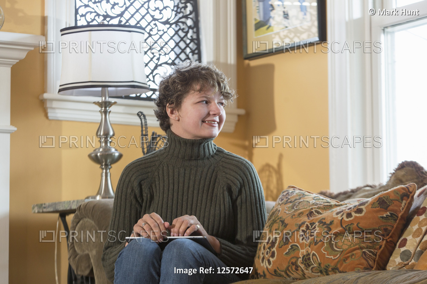 Woman with Sjogren-Larsson Syndrome resting on armchair