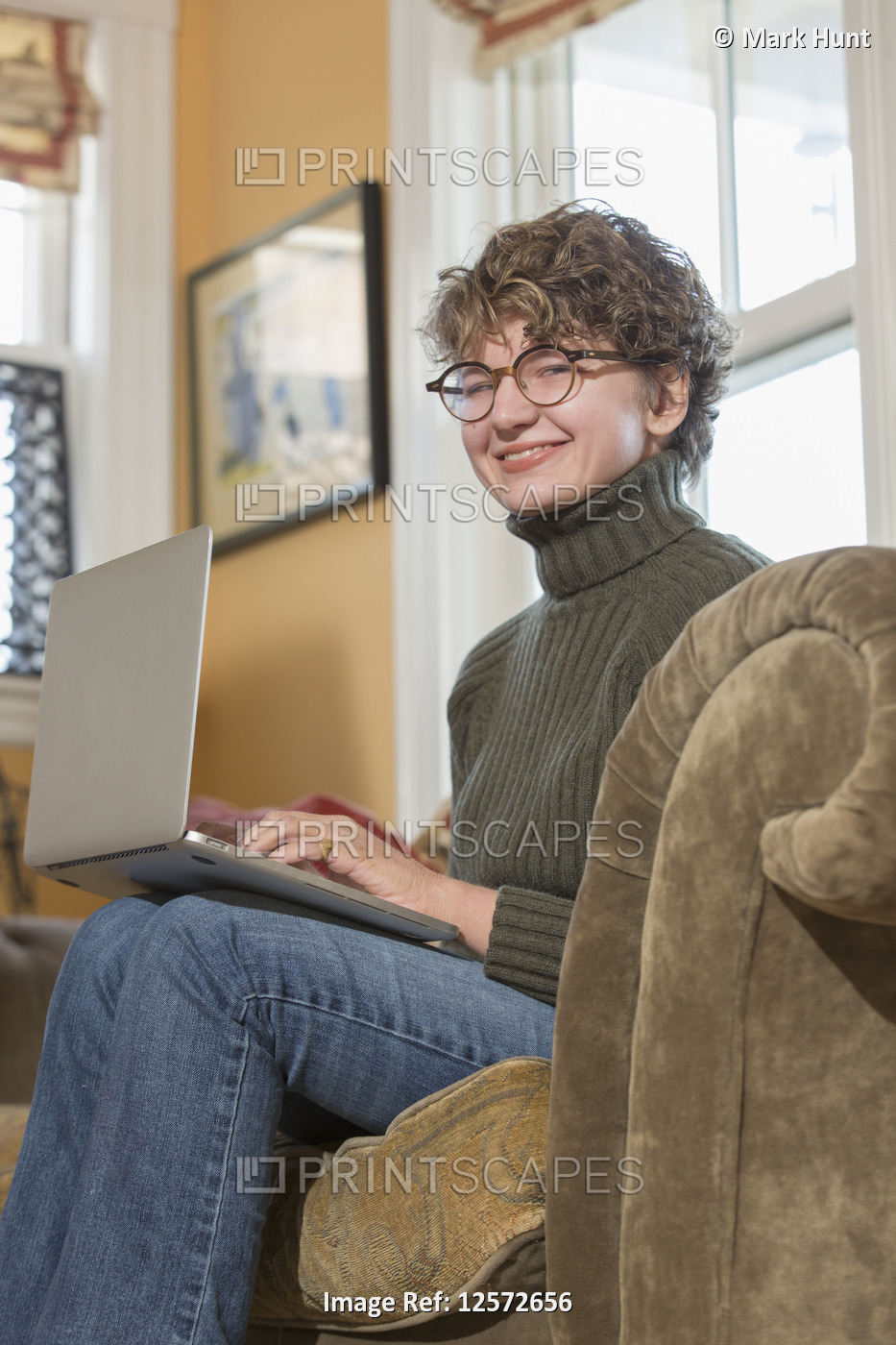 Woman with Sjogren-Larsson Syndrome using a laptop