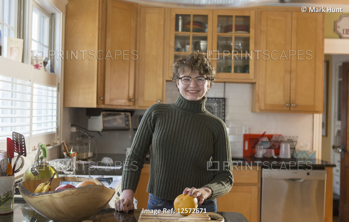 Woman with Sjogren-Larsson Syndrome standing in the kitchen