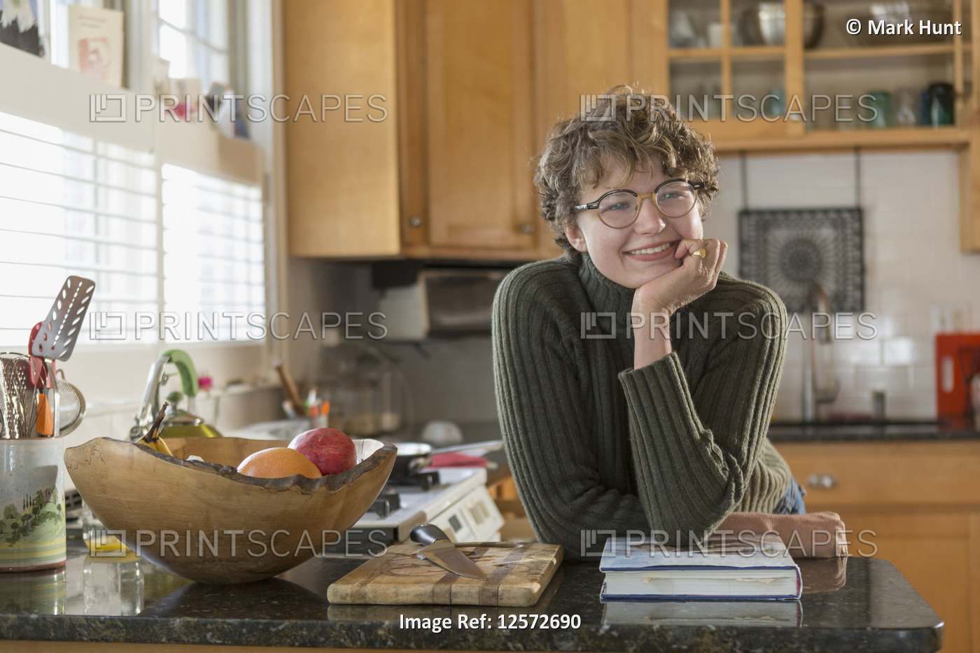 Woman with Sjogren-Larsson Syndrome leaning at kitchen counter