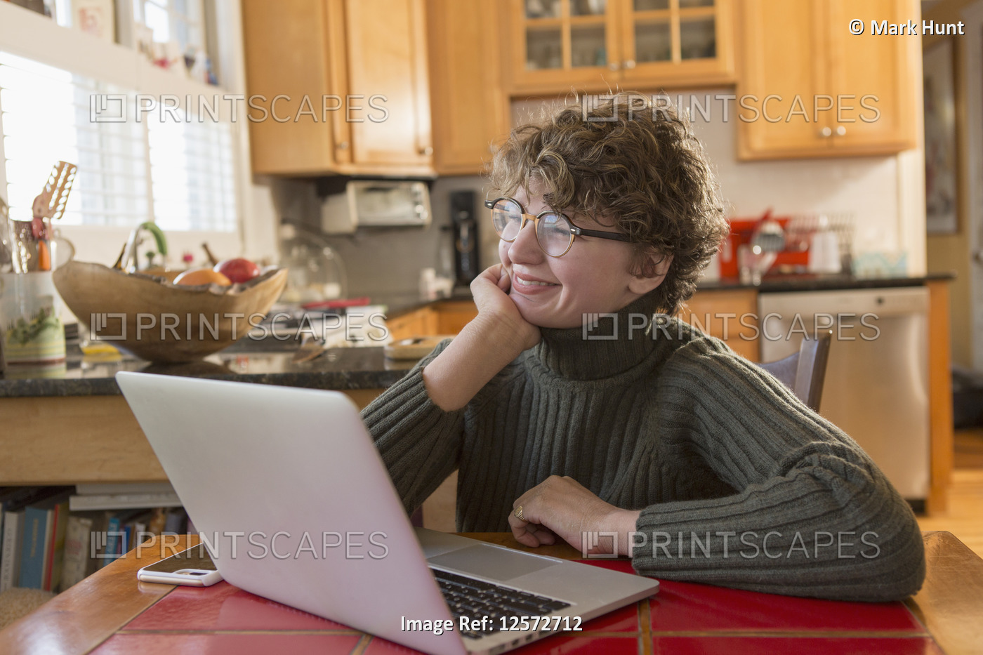 Woman with Sjogren-Larsson Syndrome using a laptop