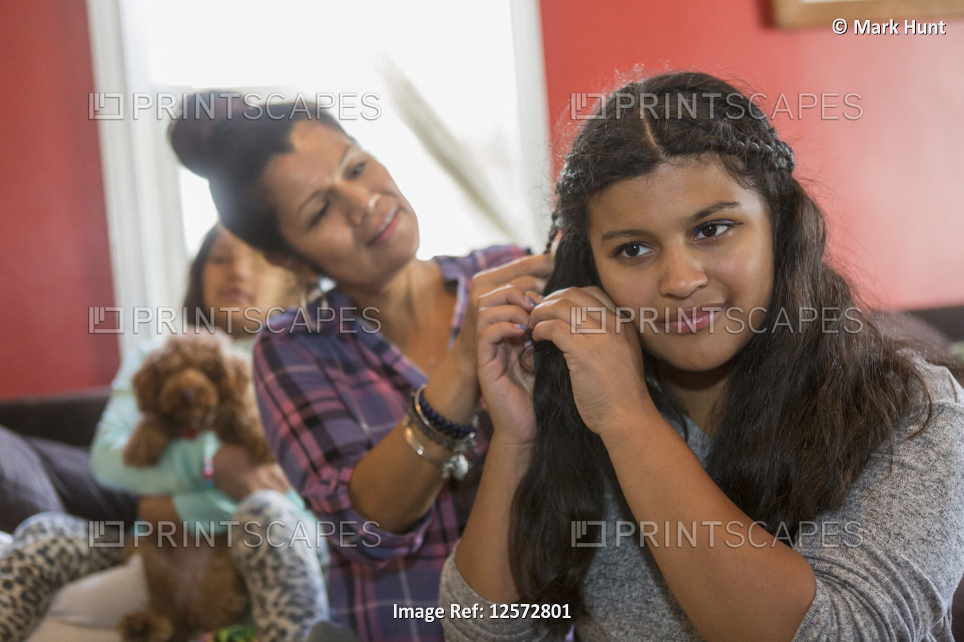 Mother doing the hair of her teen with Autism