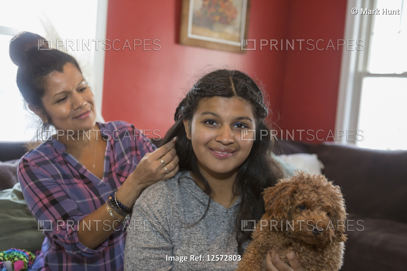 Mother doing the hair of her teen with Autism