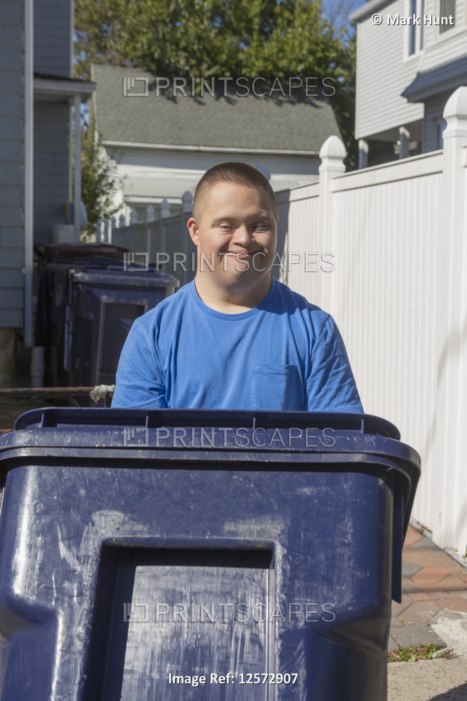 Teen with Down Syndrome getting trash