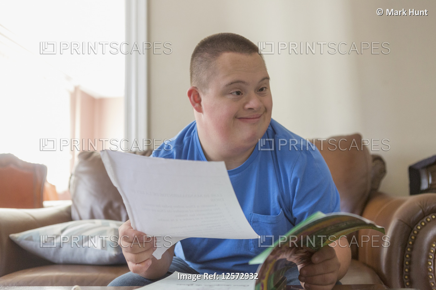 Teen with Down Syndrome studying
