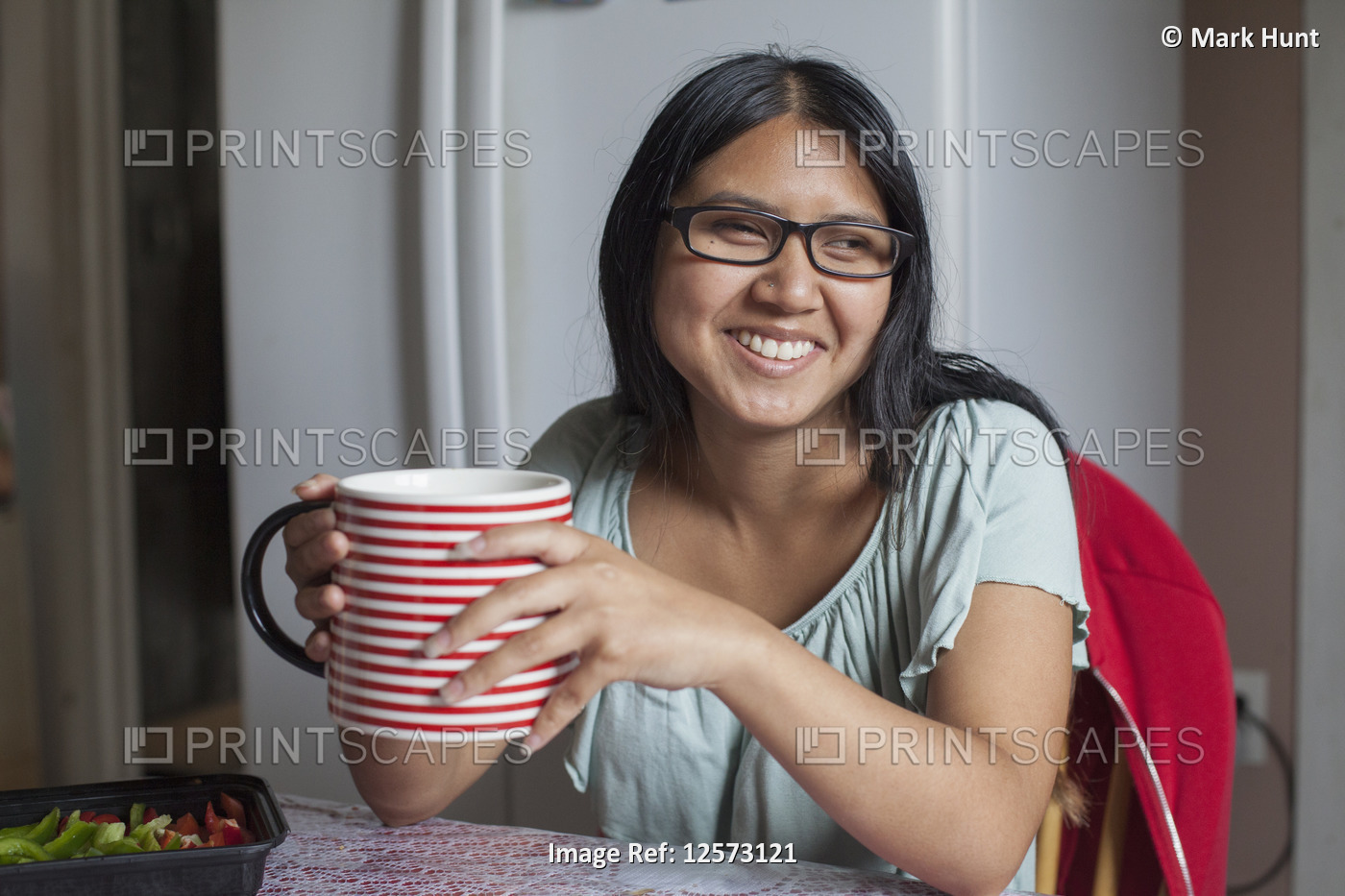 Woman with Visual Impairment enjoying a large cup of a drink