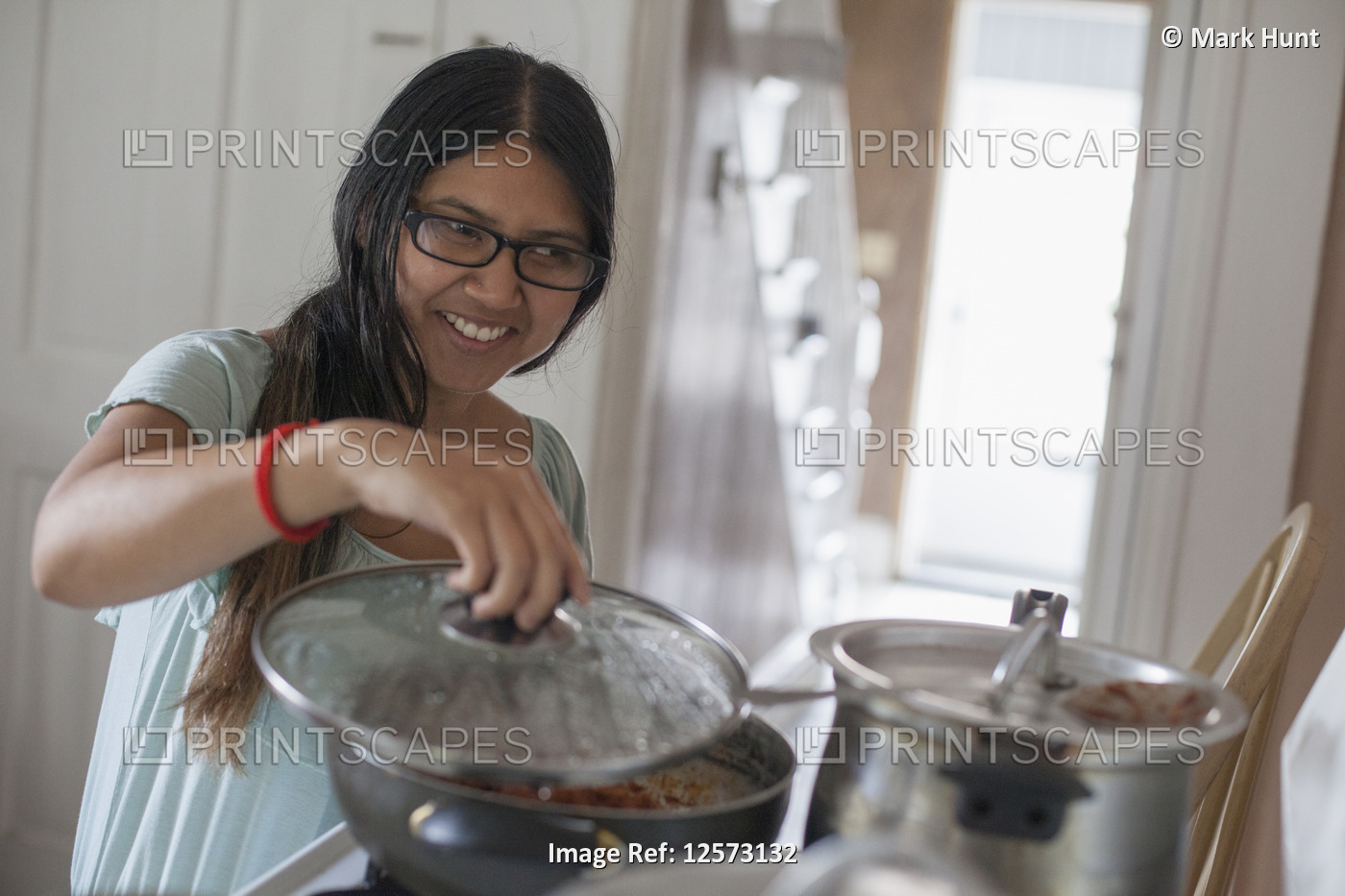 Woman with Visual Impairment cooking food in the kitchen