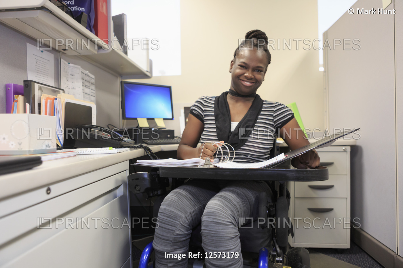 Teen with Cerebral Palsy working in an office