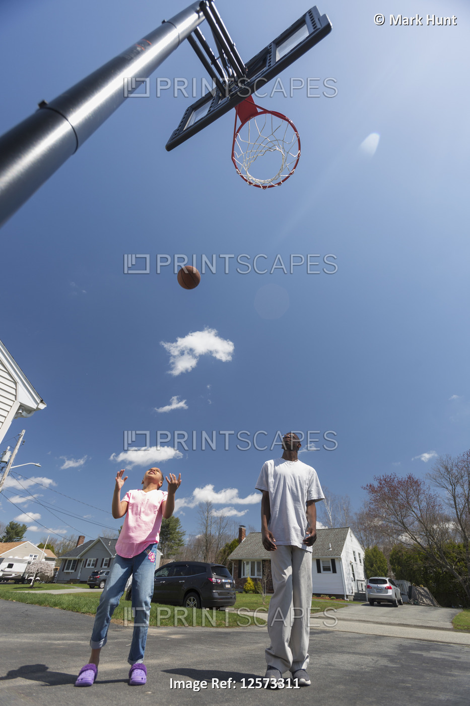 Man with Williams Syndrome playing basketball with his sister