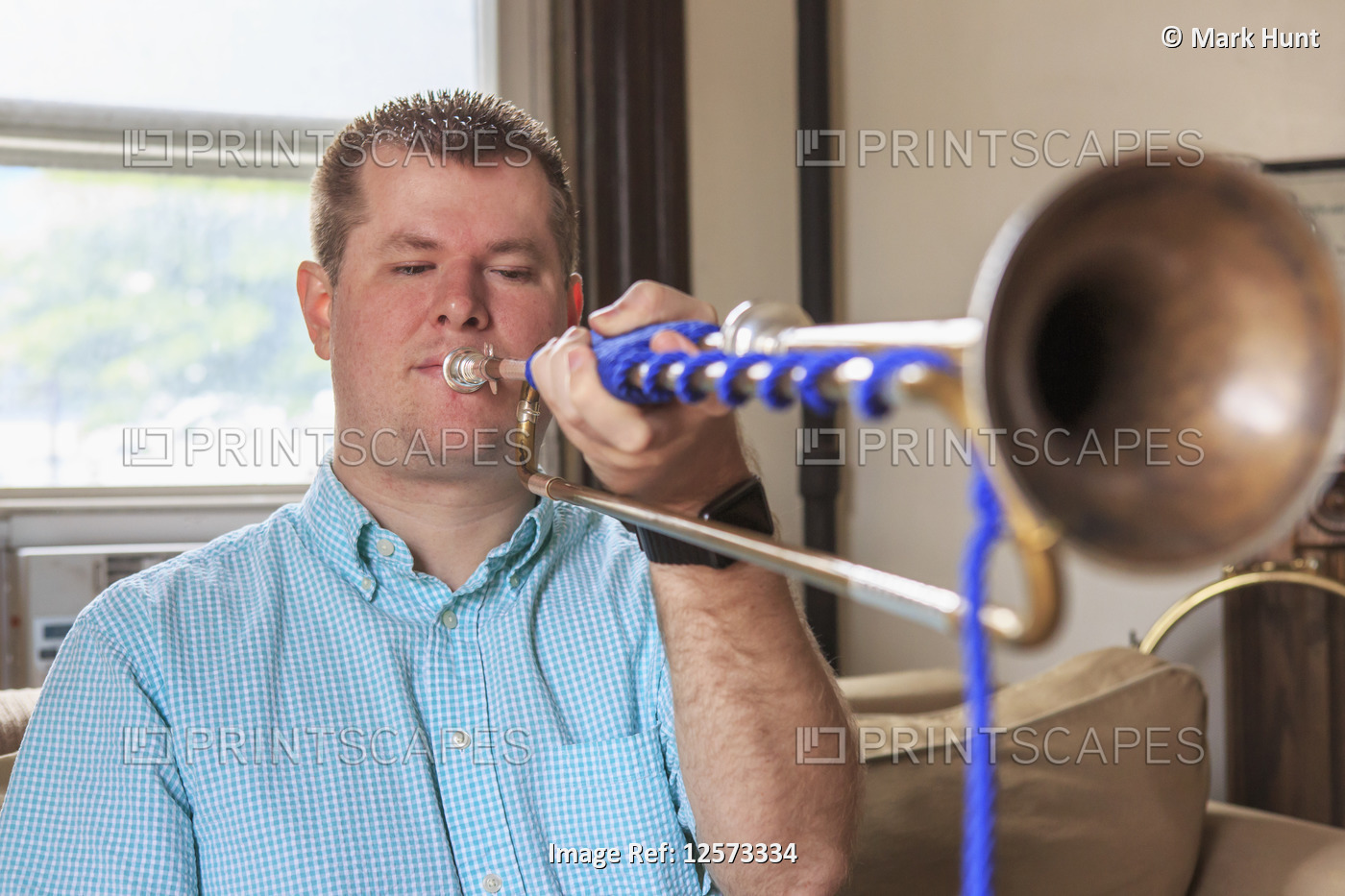 Musician with Visual Impairment playing bugle