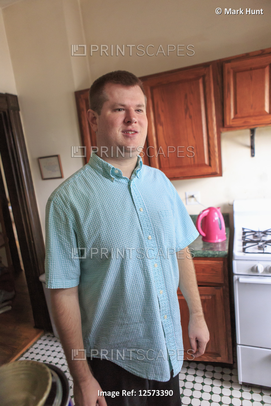 Man with Visual Impairment standing in his home