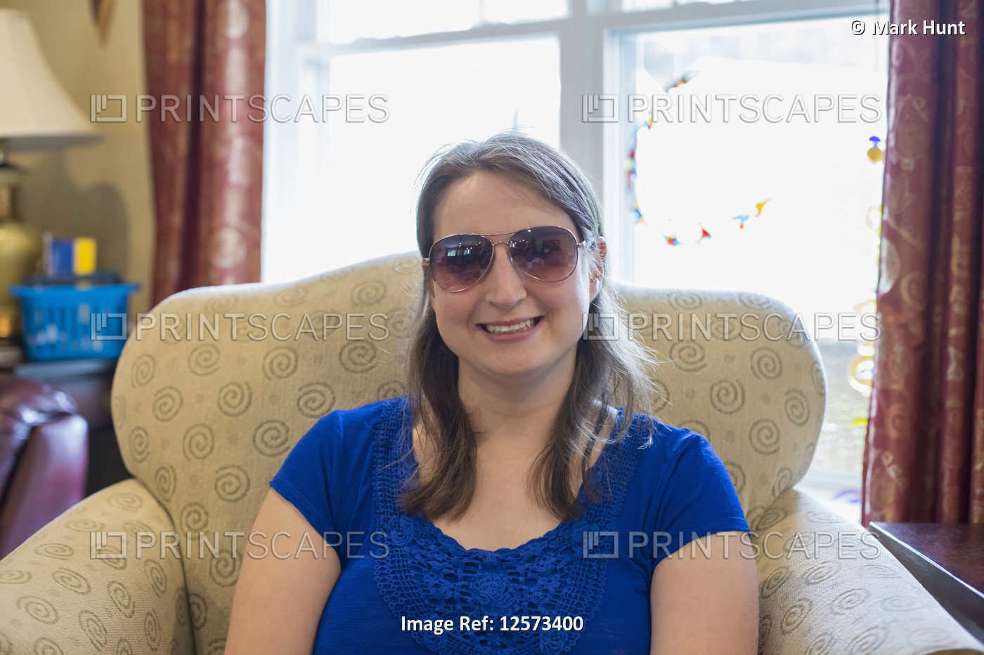 Young Woman with Cerebral Palsy smiling at home