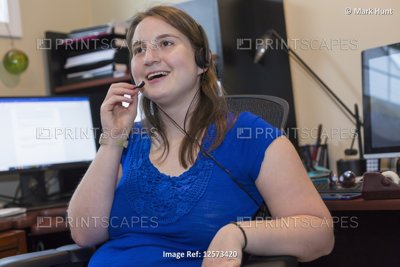 Young Woman with Cerebral Palsy wearing headset