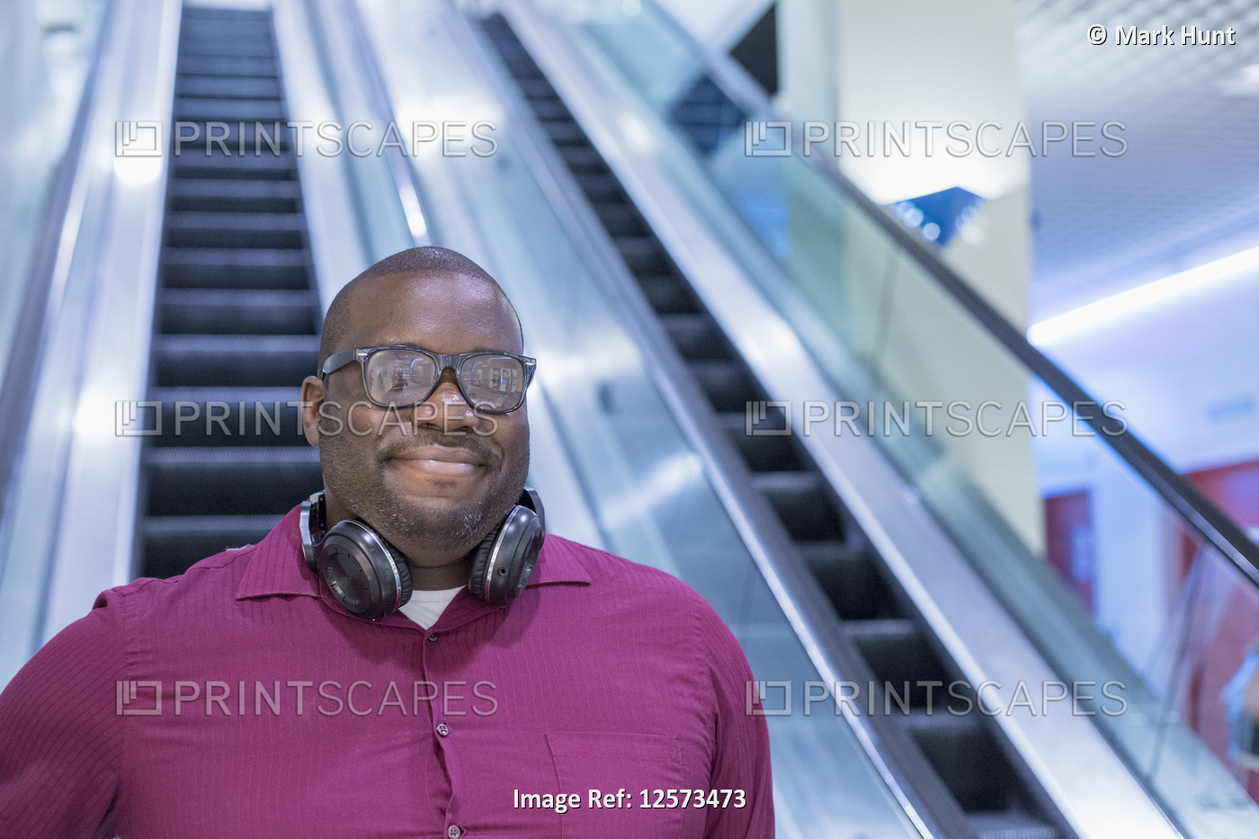 Man with ADHD on an escalator