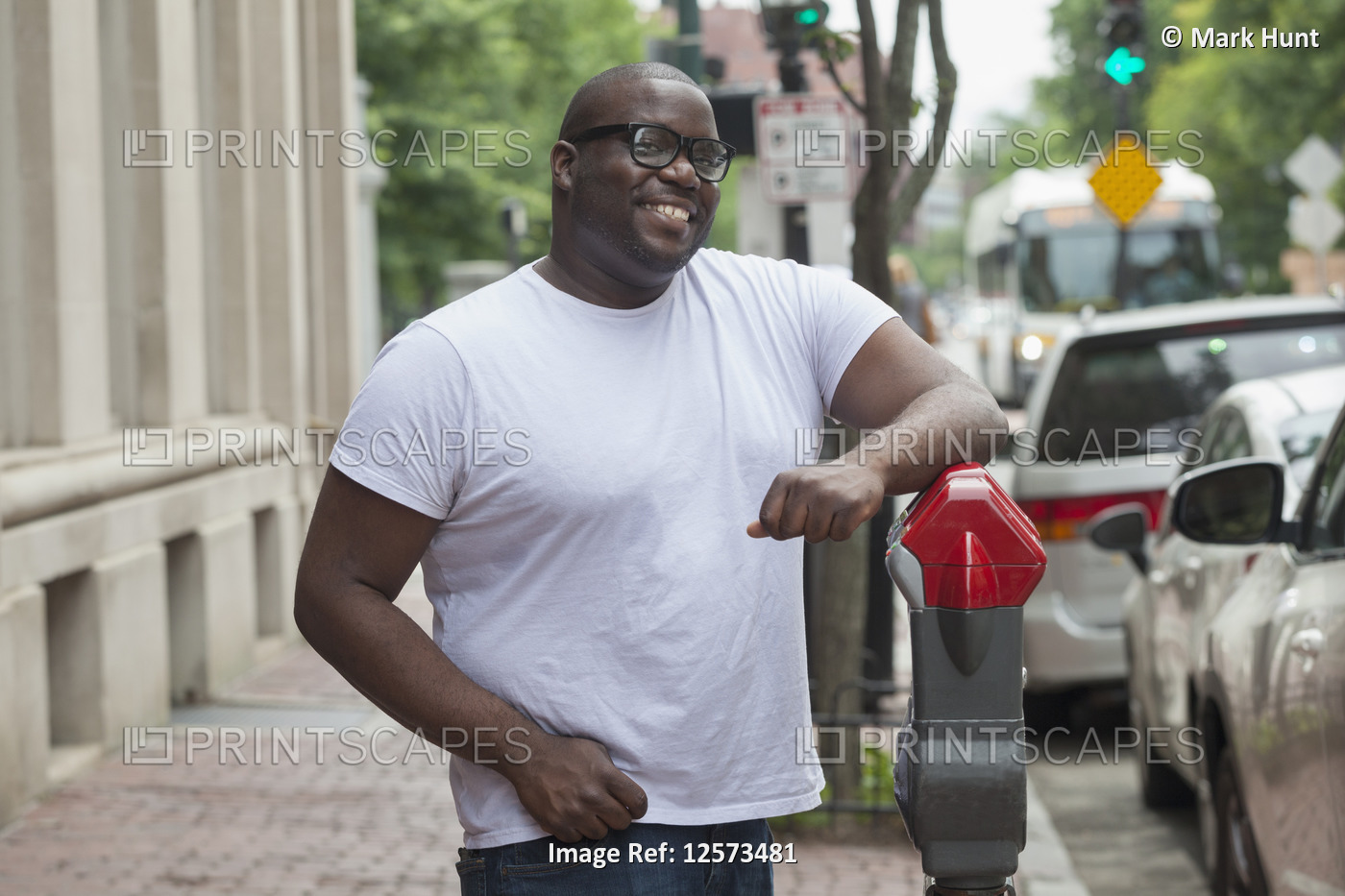Happy man with ADHD standing at a parking meter