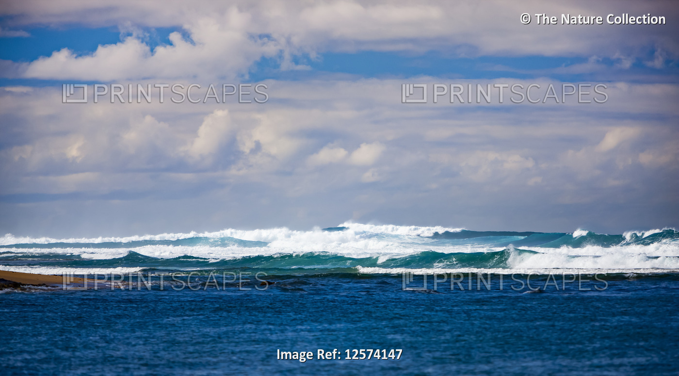 Waves breaking in the Pacific Ocean off the coast of Kauai, East Beaches; ...