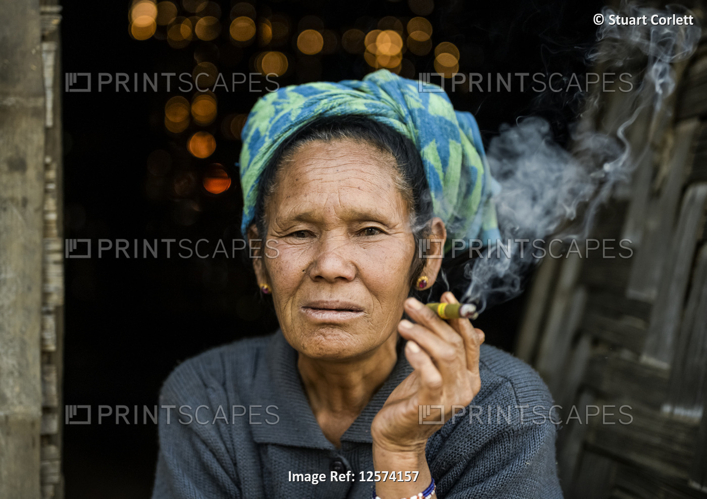 Senior woman smoking a cheroot; Taungyii, Shan State, Myanmar