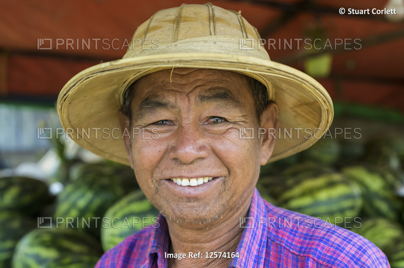 Portrait of a man selling watermelons; Taungyii, Shan State, Myanmar