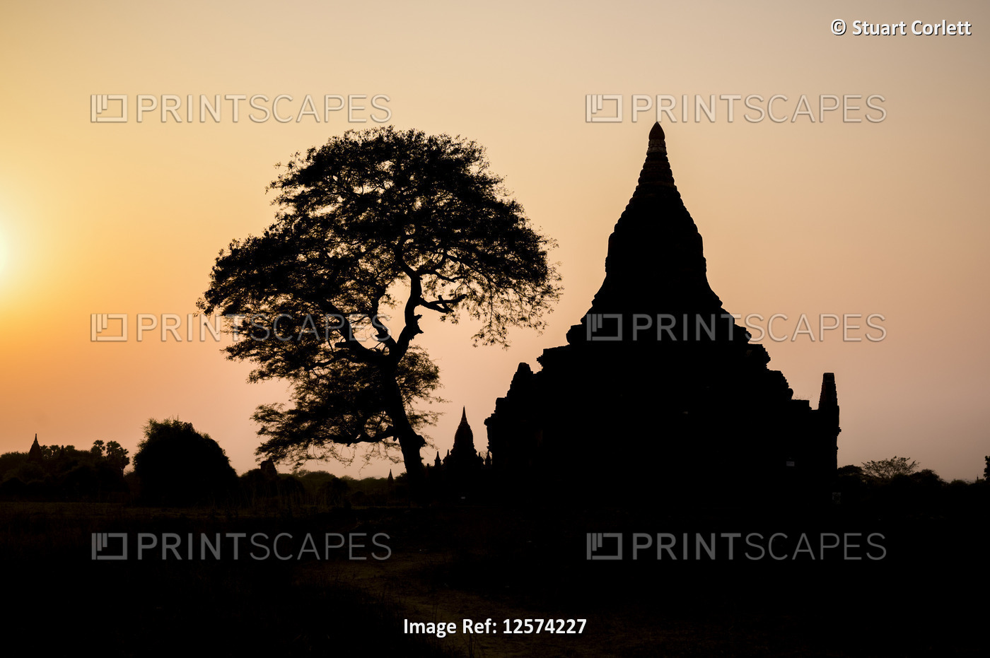Silhouetted Buddhist temple at sunset; Bagan, Mandalay Region, Myanmar