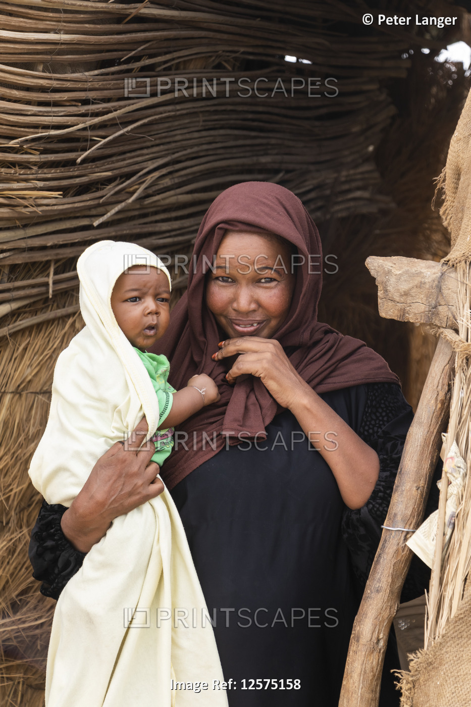 Sudanese woman holding a baby; Kokka, Northern State, Sudan