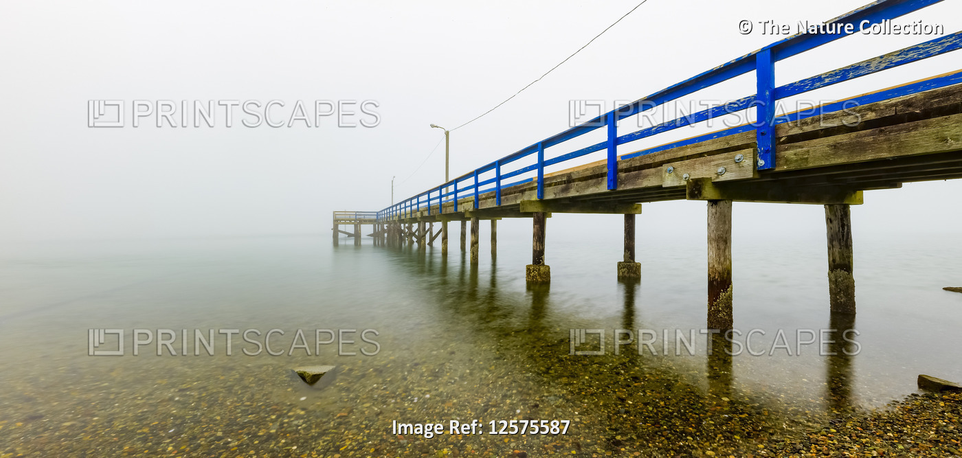 Pier in the fog on Crescent Beach; Surrey, British Columbia, Canada