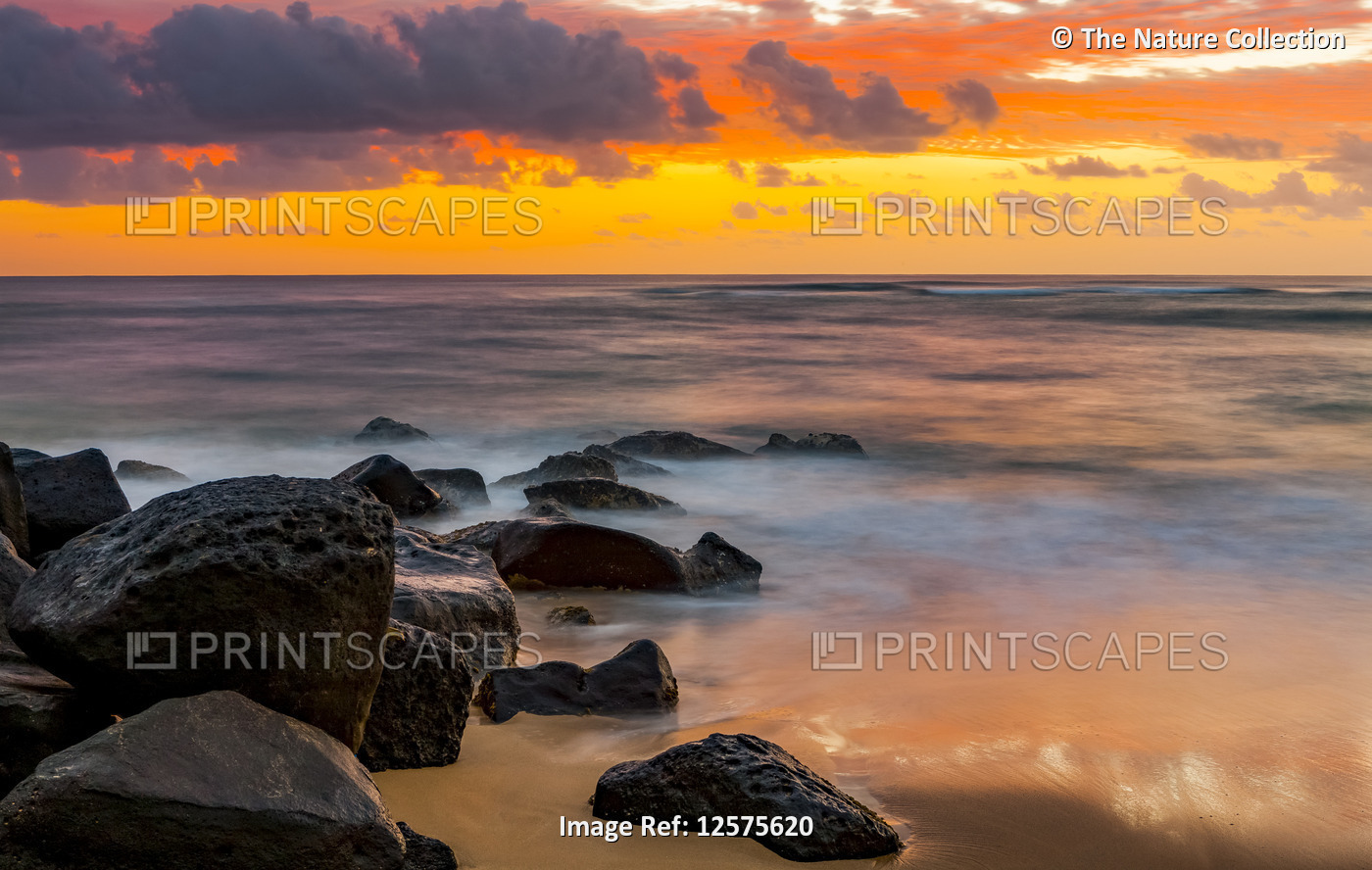 Vibrant sunrise over the Pacific Ocean; Kauai, Hawaii, United States of America