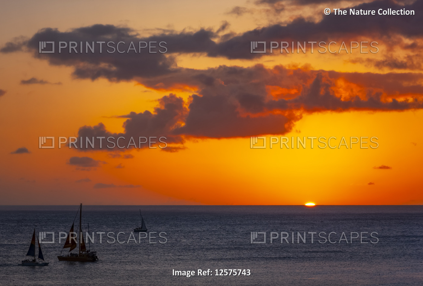 Sailing off Waikiki Beach at sunset; Honolulu, Oahu, Hawaii, United States of ...