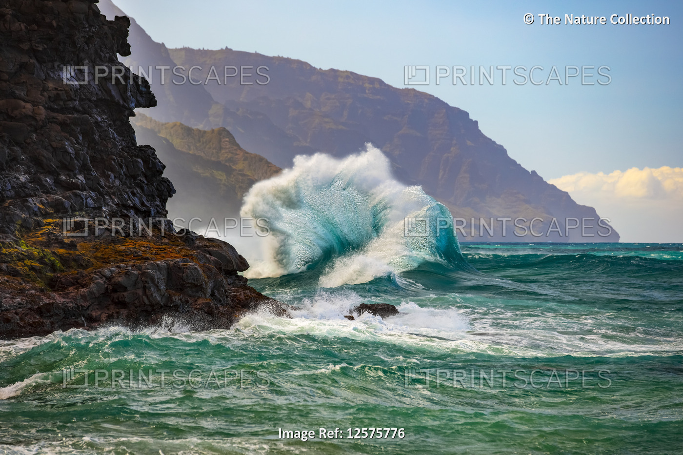 Large waves crashing along the rugged coastline of the Na Pali Coast at Ke'e ...
