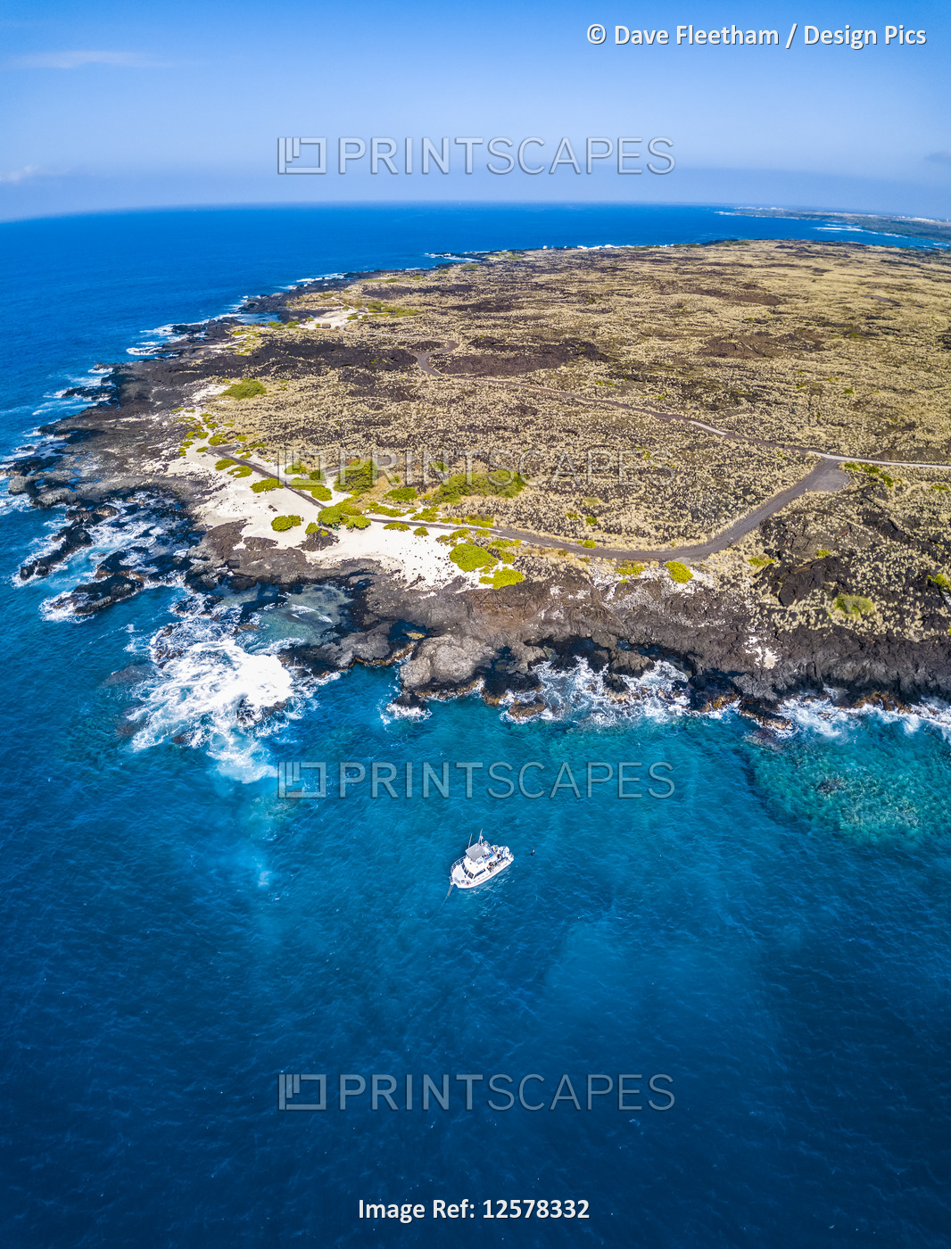 This aerial image includes a dive boat anchored at Pawai Bay and Keahuolu Point ...